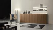 La consolle Anima Liquida di Antonio Lupi è caratterizzata da un design elegante e contemporaneo e si distingue per la sua superficie in legno, disponibile in diverse essenze o laccata, che si sovrappone alla parete in un gioco armonioso di forme e volumi. Con un fronte continuo e raffinato, interrotto solo da tagli verticali che ne evidenziano la modularità, Anima Liquida offre non solo uno spazio di appoggio pratico ma anche una soluzione esteticamente accattivante per arricchire l'arredamento.